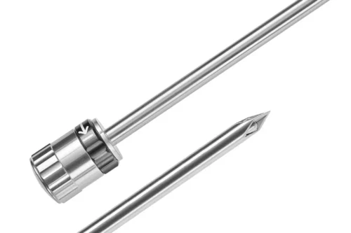 Punzón de trocar retractil